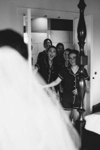 Bridal Party Getting Ready First Look Portrait, Bridesmaids in Matching Pajama Rompers