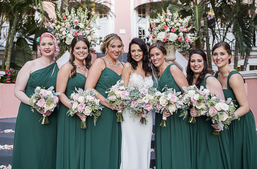 Outdoor Tropical Garden Bridal Party Portrait with White and Pink Rose with Succulent and Greenery Bouquet, Bridesmaids in Mismatched Hunter Green Brideside Dresses | St Pete Hair and Makeup Femme Akoi Studio | Hotel Venue The Don CeSar