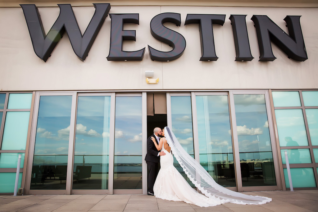 Outdoor Rooftop First Look Bride and Groom Portrait, Groom in Cathedral Veil at Hotel Wedding Venue Westin Tampa Bay