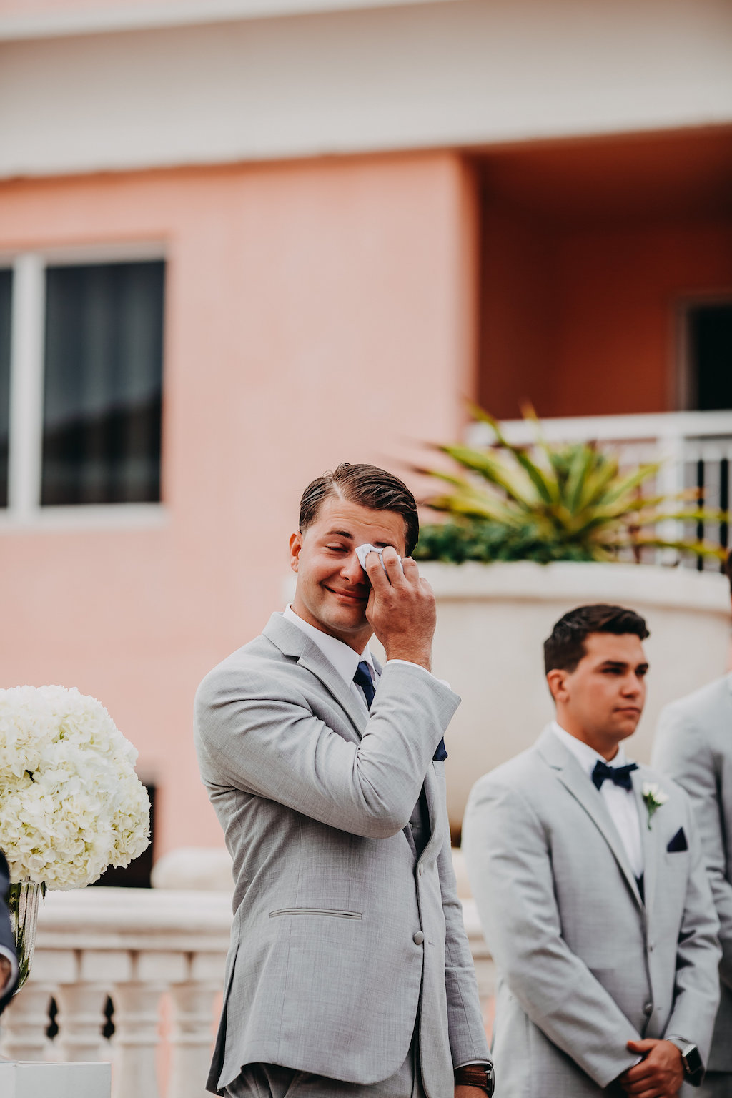 Wedding Ceremony Groom First Look Portrait, wearing Light Gray Wuit with Navy Blue Tie and White Boutonniere | Clearwater Wedding Photographer Rad Red Creative
