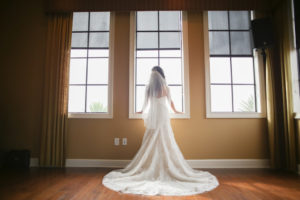 Indoor Bride Getting Ready Portrait wearing Morilee Madeline Gardner Strapless Wedding Dress | Tampa Bay Wedding Photographer Lifelong Photography Studios