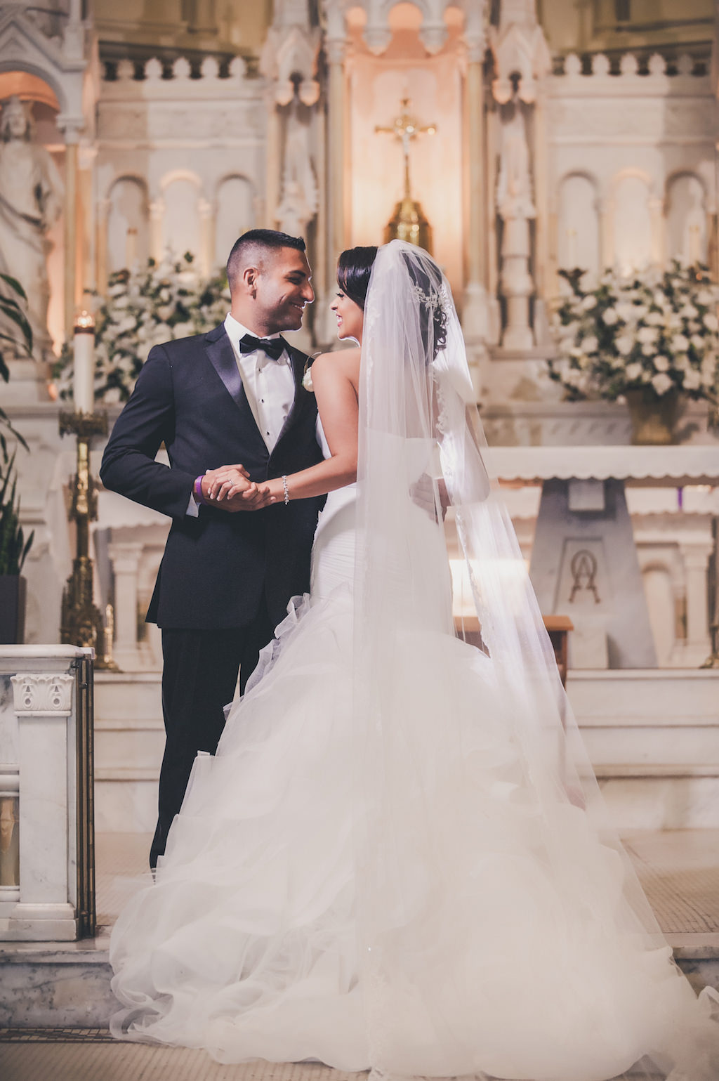 Traditional Church Wedding Ceremony, With White and Greenery Flower Arrangements Bride in Pronovias Layered Mermaid Strapless Dress | Downtown Tampa Wedding Ceremony Venue Sacred Heart Catholic Church