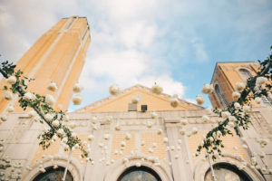Outdoor Wedding Ceremony with White Hanging Florals and Greenery Arch | Tarpon Springs Traditional Wedding Venue St. Nicholas Greek Orthodox