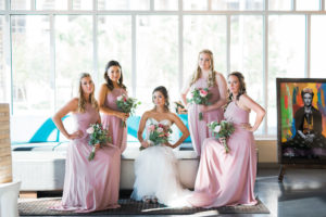 Indoor Bridal Portrait in Princess Strapless Mermaid Enzoani Wedding Dress with Pink, BLush and White Floral with Greenery Bouquet, Bridesmaids in Matching High Neck Blush Pink Azazie Dresses | Tampa Wedding Photographer Kera Photography