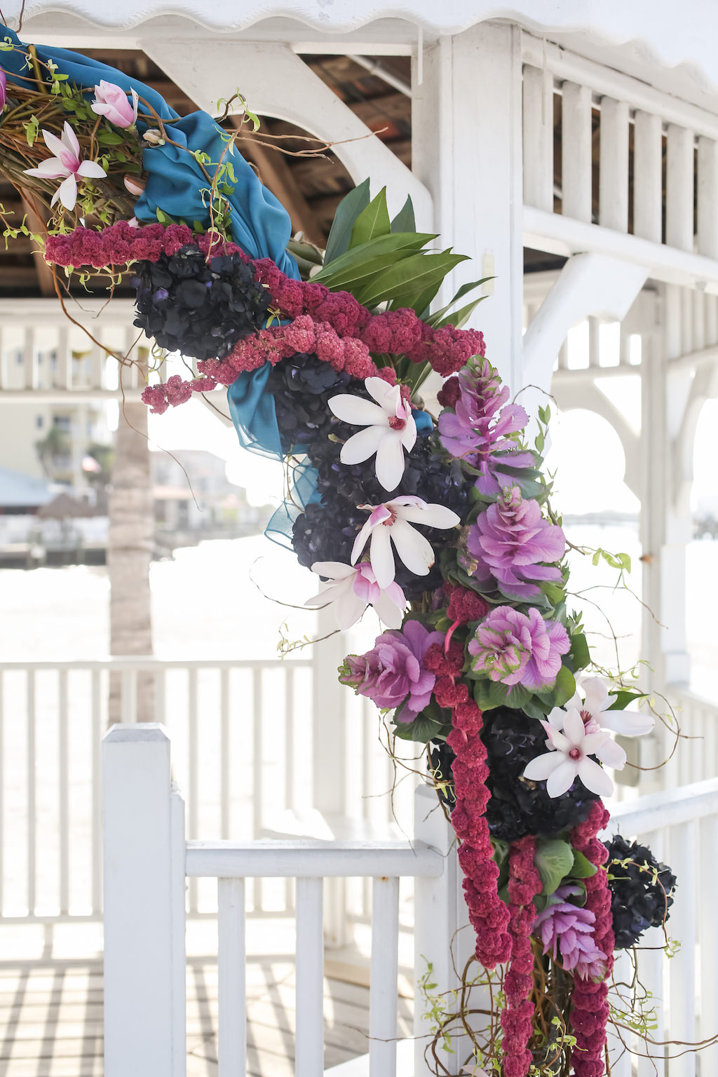Whimsical Purple, Black, Magenta, Fuchsia, Plum and White Floral Wedding Arch with Greenery with Turquoise Draping | Tampa Bay Wedding Florist Gabro Event Services