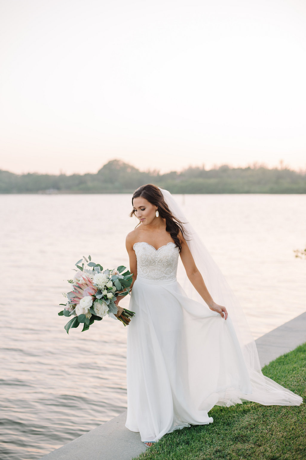 Organic Greenery Inspired Neutral Pastel Wedding Ceremony Arch for Outdoor Waterfront Siesta Key Wedding | Sarasota Wedding Planner Jennifer Matteo Events