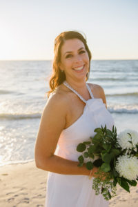 Outdoor Beach Bridal Portrait, Bride in Halter DaVinci Wedding Dress, with White Floral and Natural Greenery Bouquet | Treasure Island Wedding