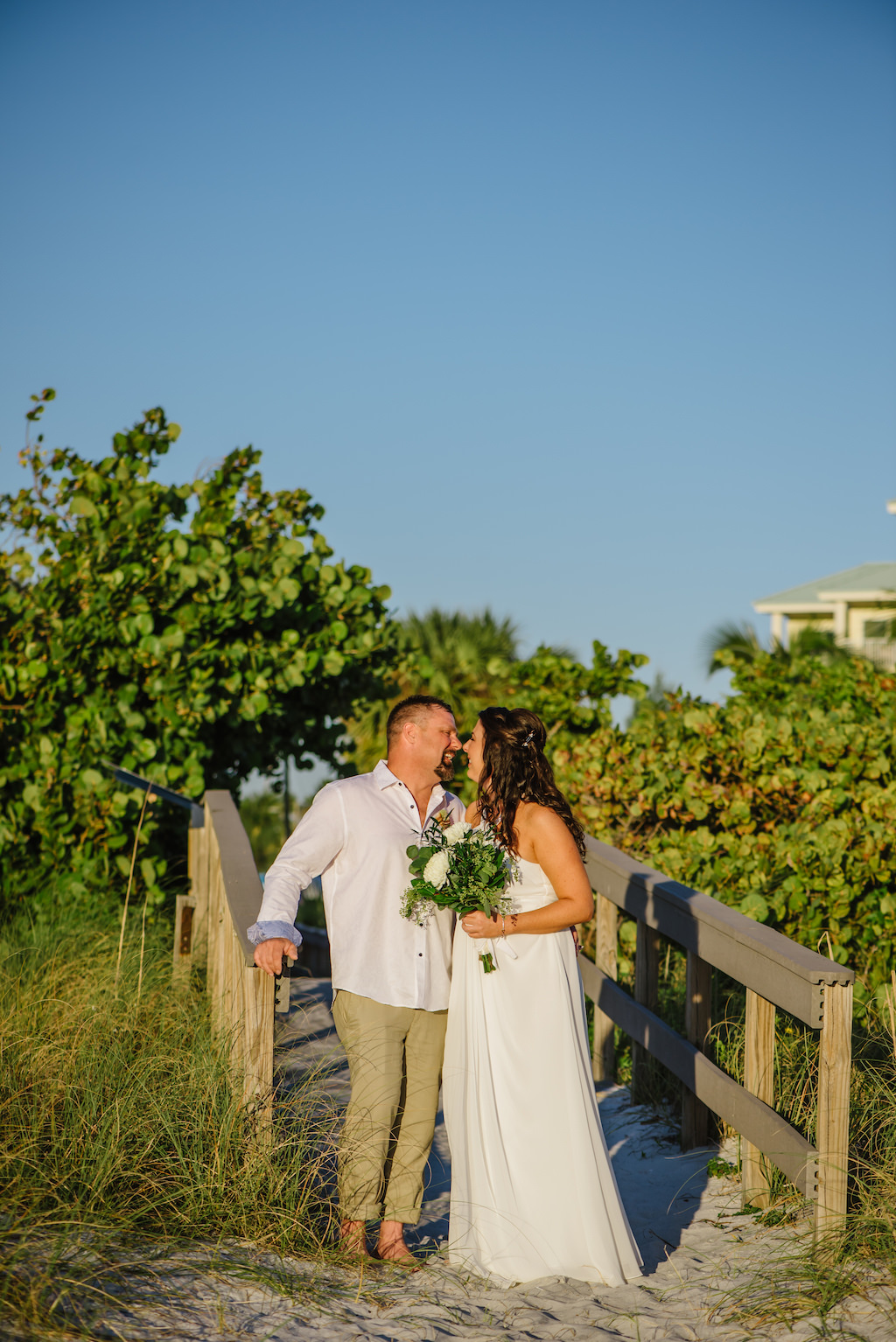 Outdoor Beach Bride and Groom Wedding Portrait, Bride with White and Greenery Bouquet