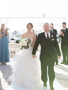 Outdoor Waterfront Wedding Ceremony Portrait, Bride in Layered Ballgown Dress, Bridesmaids in Long Dusty Blue Dresses, with White Rose and Greenery Bouquet, Groom and Groomsmen in Black Suits | Tampa Bay Wedding Venue The Westshore Yacht Club | Planner Unique Weddings and Events