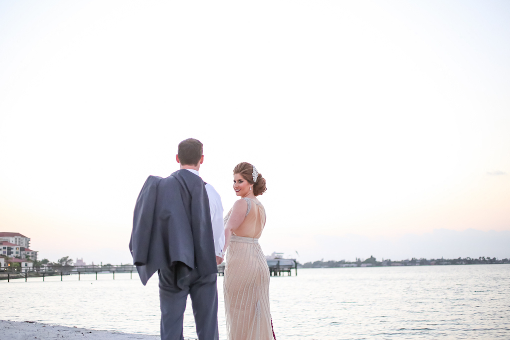 Outdoor Beach Wedding Portrait, Bride in Jeweled Ivory Open Backed Dress, Groom in Gray Suit | St. Pete Waterfront Wedding Venue Isla Del Sol Yacht and Country Club | Dress Shop Truly Forever Bridal | Menswear Sacino's Formalwear | Hair and Makeup Michele Renee The Studio | Photographer Lifelong Studios Photography