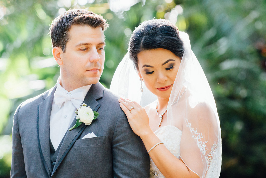 Outdoor Garden Wedding Portrait, Groom in Gray Tuxedo with White Bowtie and White Floral with Greenery Boutonniere