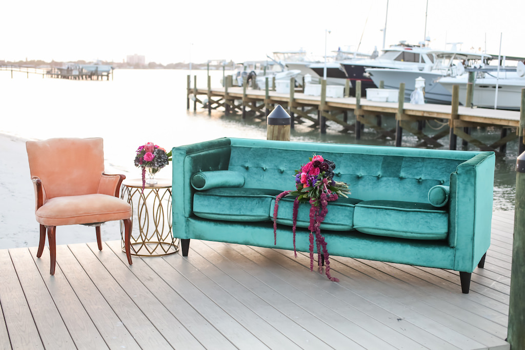 Outdoor Dockside Waterfront Wedding Reception Lounge with Velvet Turquoise Couch, Peach Armchair with Copper Table, with Pink, Fuchsia, Plum and Greenery Cascading Bouquet | Furniture and Couch Rentals A Chair Affair | Planner Kelly Kennedy Weddings and Events | Florist Gabro Event Services | Venue Isla Del Sol Yacht and Country Club