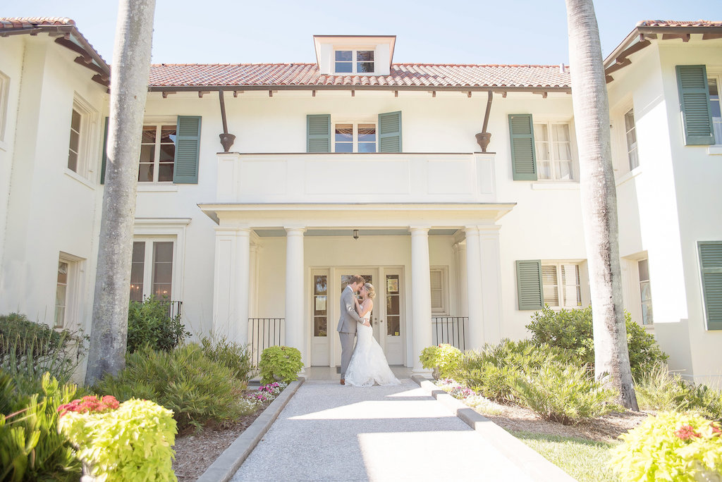 Outdoor Bride and Groom Wedding Portrait, Groom in Gray Suit, Bride in Lace Trumpet Allure Bridals Dress | Sarasota Wedding Photographer Kristen Marie Photography | Historic Venue The Edson Keith Mansion
