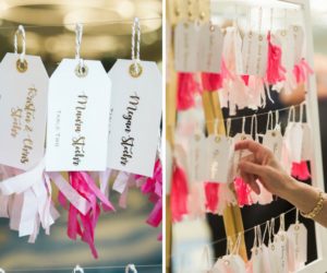 Whimsical Pink and Gold Wedding Foil Printed Luggage Tag with Tissue Paper Tassel Escort Cards on White Frame and Wire Hanger