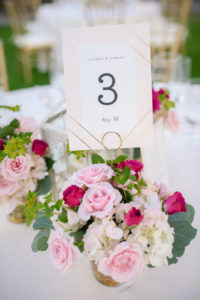 Outdoor Garden Tropical Wedding Reception Centerpiece with Small Pink Rose, White and Magenta Floral with Greenery in Small Gold Mercury Vases, and Gold Geometric Printed Table Number | Tampa Bay Wedding Planner NK Productions | Sarasota Beach Wedding Venue Longboat Key Club