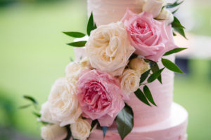 Round White to Pink Ombre Wedding Cake and White and Pink Roses with Greenery