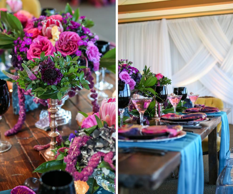 Vibrant Whimsical Wedding Reception Wooden Feasting Table with Black Flatware, Wine Glasses, and Plates, Copper Chargers and Votive Candleholders, Low Plum and Fuchsia Florals with Greenery Centerpieces, Pink and Purple Watercolor Napkins and Turquoise Linen Runners, Glitter Rock Candy Favors | Tampa Bay Wedding Planner Kelly Kennedy Weddings and Events | Furniture Rentals A Chair Affair | Florist Gabro Event Services