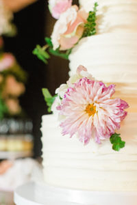 Round White Wedding Cake with Pink Flowers and Greenery