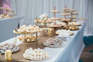 Gold and Pink Whimsical Wedding Reception Desert Table with Small treats on Tiered Gold Stands, with Sequin Table Runner | Tampa Bay Ballroom Wedding Venue Hilton Clearwater Beach