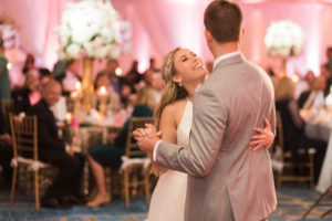 Whimsical Pink and Gold Hotel Ballroom Wedding Reception First Dance Portrait, Bride in Halter Wedding Dress with Jeweled Headband | Tampa Bay Venue Hilton Clearwater Beach