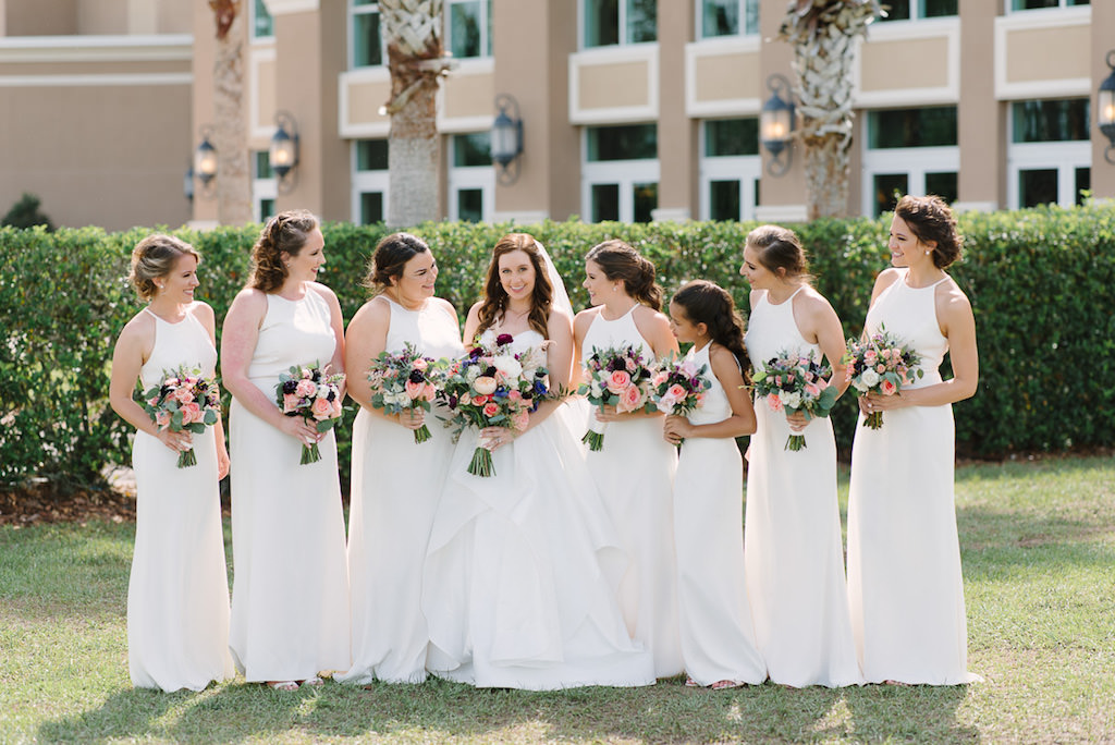 Outdoor Tampa Bridal Party Portrait, Bridesmaids in Halter White Floor length Dessy Dresses, with Peach, Purple, White and Pink Flower with Greenery Bouquets | Tampa Bay Bridesmaid Dress Shop Bella Bridesmaids
