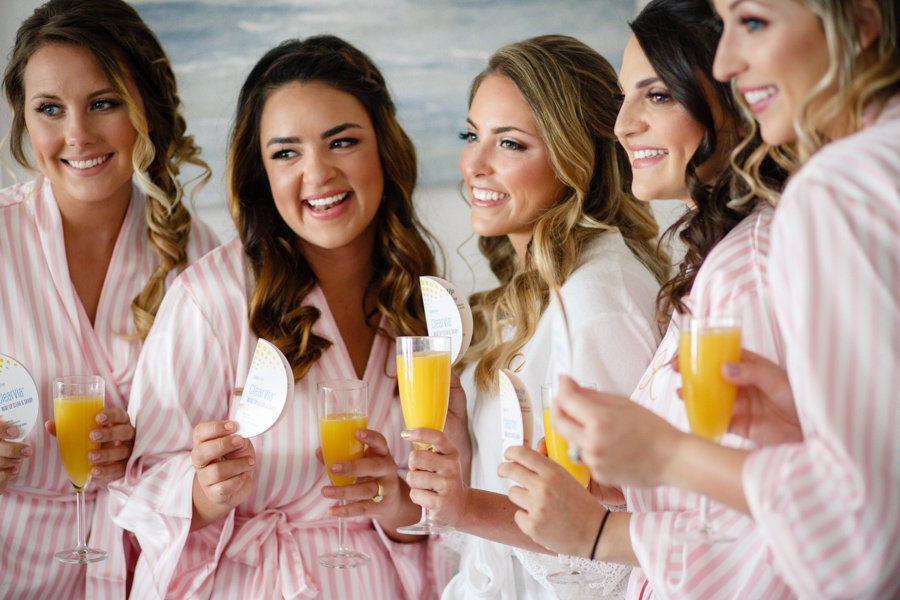 Indoor Bridal Party Portrait in Matching Pink and White Candy Stripe Robes