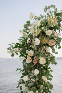 Organic Greenery Inspired Neutral Pastel Wedding Ceremony Arch for Outdoor Waterfront Wedding