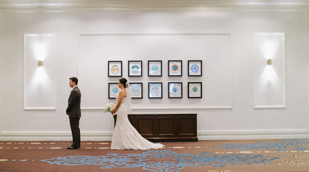 Hotel Interior Bride and Groom First Look Portrait, Bride in Strapless Allure Lace Dress