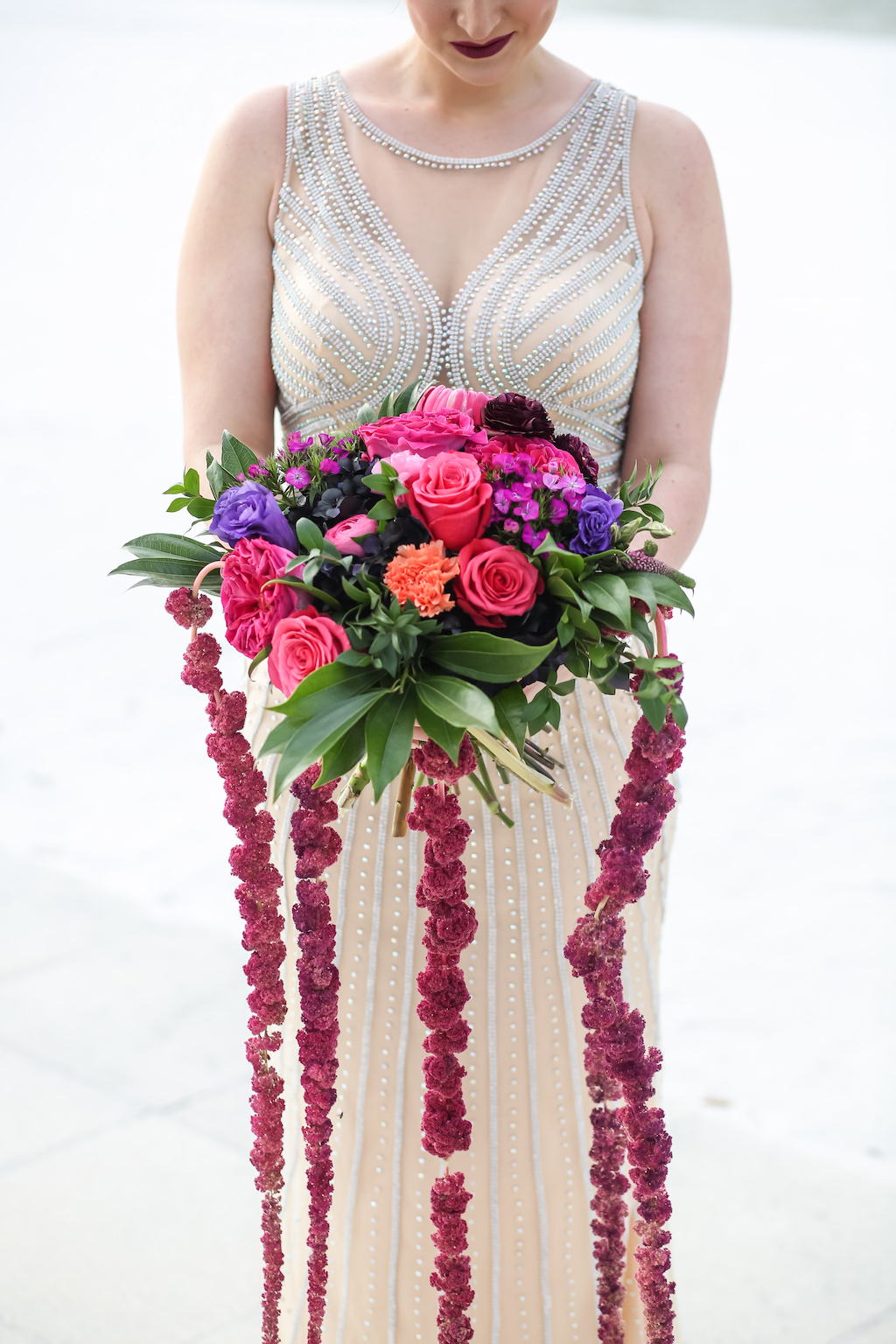 Outdoor Bridal Portrait in Beaded Ivory Illusion Wedding Dress with Pink Rose, Purple Floral, Fuchsia Cascade Flowers with Greenery Bouquet | Tampa Bay Wedding Boutique Truly Forever Bridal | Rentals and Florist Gabro Event Services | Photographer Lifelong Studios Photography