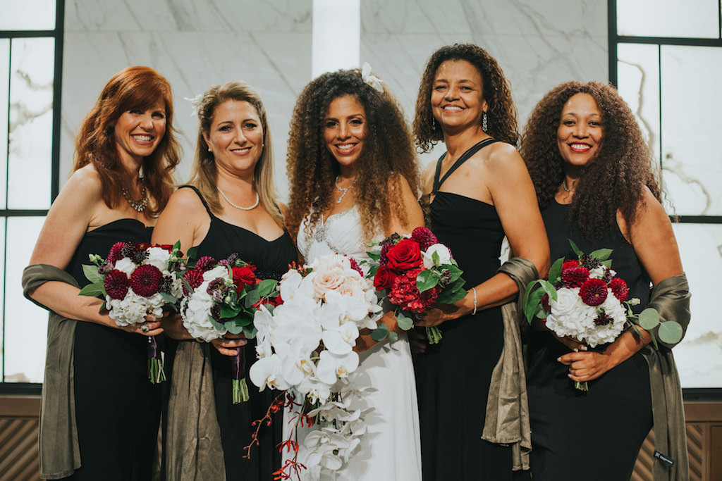 Red and White Wedding Ceremony Bridal Party Portrait, Bride with White Orchid and Red Floral Bouquet, Bridesmaids in MIsmatched Black Dresses with Matching Grey Silk Shawls and White and Red Bouquets with Greenery | Clearwater Beach Wedding Photographer Brandi Image Photography | Hair and Makeup Michele Renee The Studio