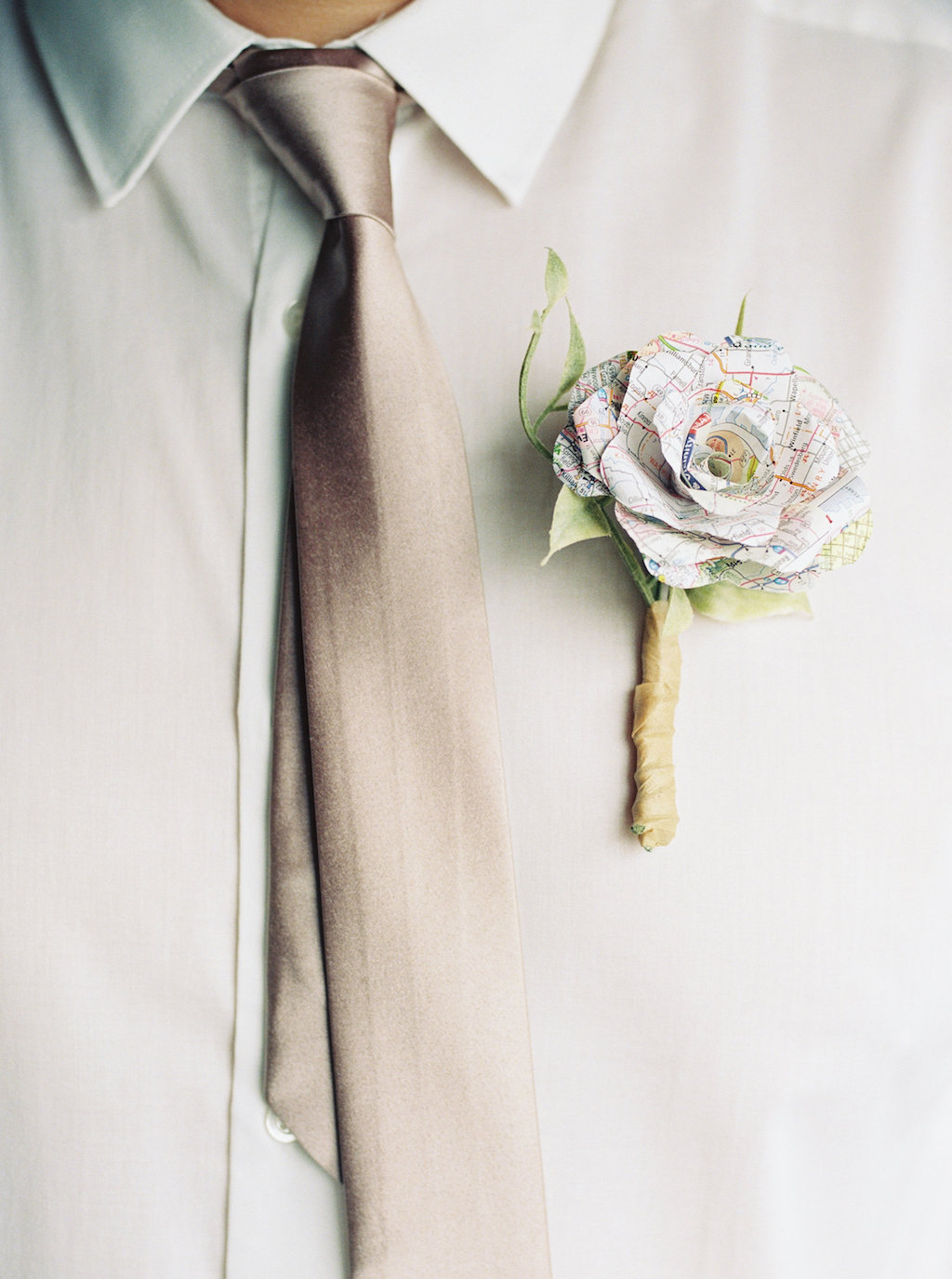 Vintage Travel Inspired Groom with Taupe Satin Tie, and White Paper Map Rose Boutonniere