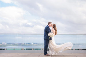 Hotel Rooftop Outdoor Wedding Portrait, Groom in Navy Suit with White and Pink Bouquet | Waterfront Hotel Wedding Venue The Westin Tampa Bay