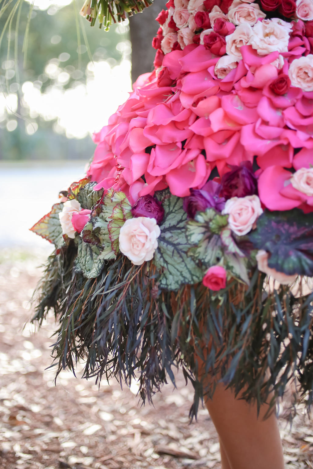 Outdoor Bridal Portrait in Creative Flower Dress with Pink, Fuchsia, Purple, Red and White Florals with Greenery | Tampa Wedding Florist Gabro Event Services
