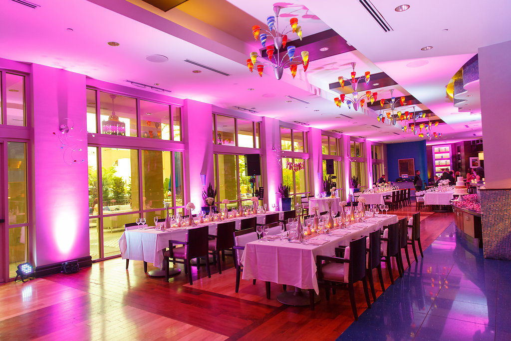Colorful Indoor Hotel Wedding Reception with Long Feasting Tables, Gold Table Accents, and Colored Glass Lights | Venue The Tampa Renaissance