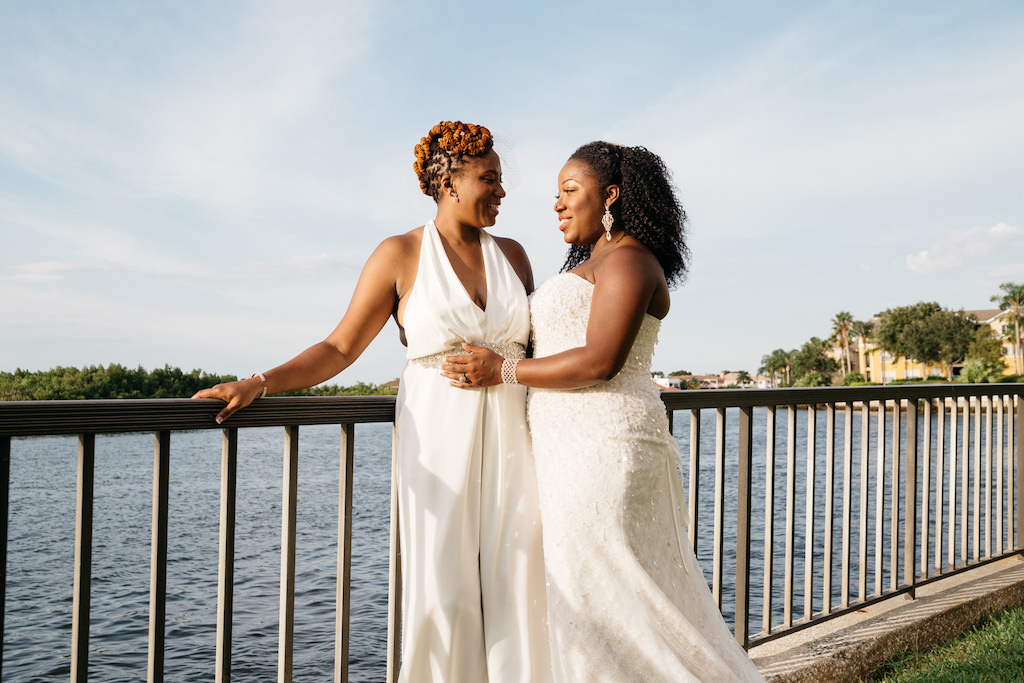 Outdoor Waterfront Wedding Portrait, Bride in Halter BHDLN Pantsuit and Beaded Strapless David's Bridal Dress | Tampa Waterfront Hotel Wedding Venue DoubleTree Suites by Hilton