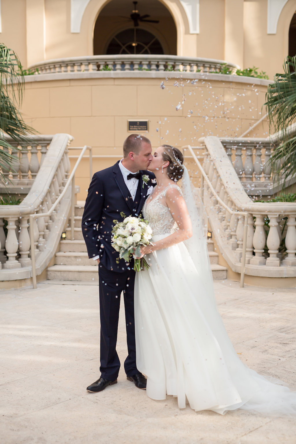Outdoor Hotel Garden Wedding Ceremony Portrait, Bride in A Line WEdding Dress with White Rose and Greenery Bouquet, Groom in Navy Suit | Sarasota Wedding Photographer Cat Pennenga Photography | Downtown Venue The Ritz Carlton