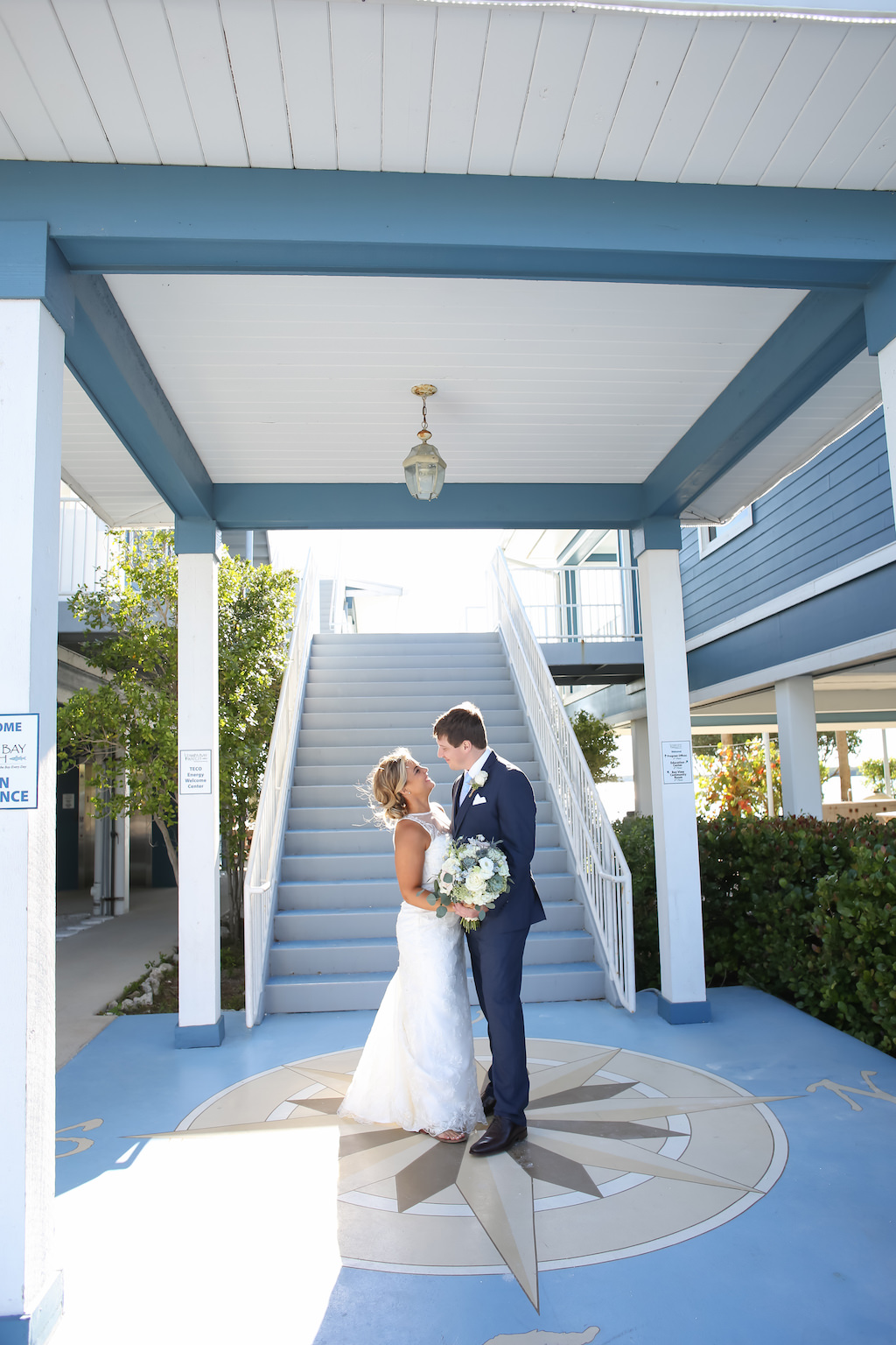 Outdoor Porch Wedding Portrait with White Rose and Natural Greenery Bouquet, Bride in Lace Column Dress | Venue Tampa Bay Watch | St Petersburg Wedding Photographer Lifelong Photography Studio