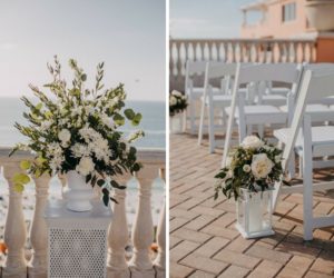 Waterfront Tampa Bay Luxury Hotel Wedding Ceremony with White Folding Chairs, Ivory FLorals with Greenery in Hurricane Lanterns in Aisle and on Pedestals | Tampa Bay Wedding Venue Hyatt Clearwater Beach and Spa