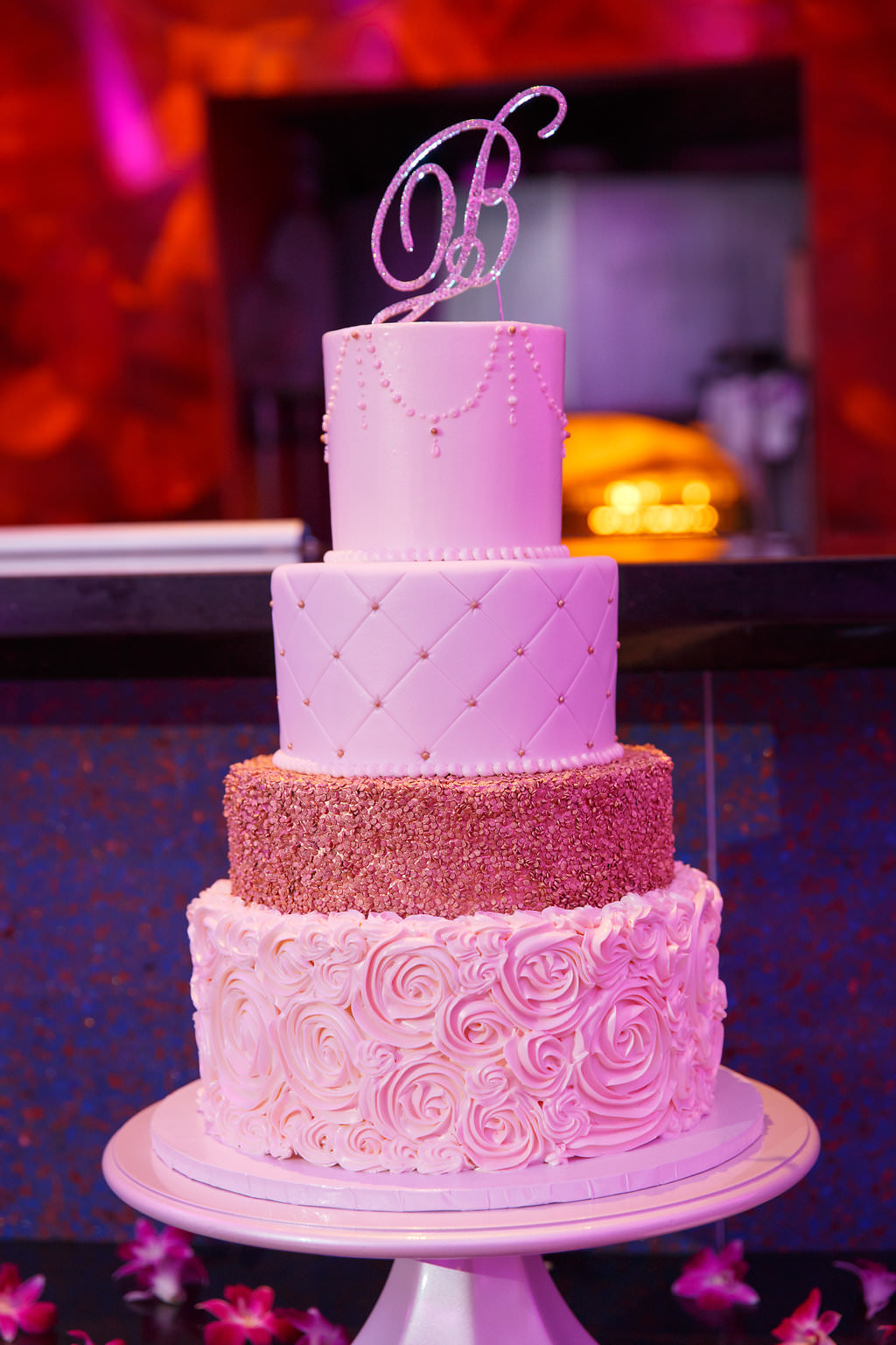 Four Tiered Round White And Gold Wedding Cake With Stylish Silver