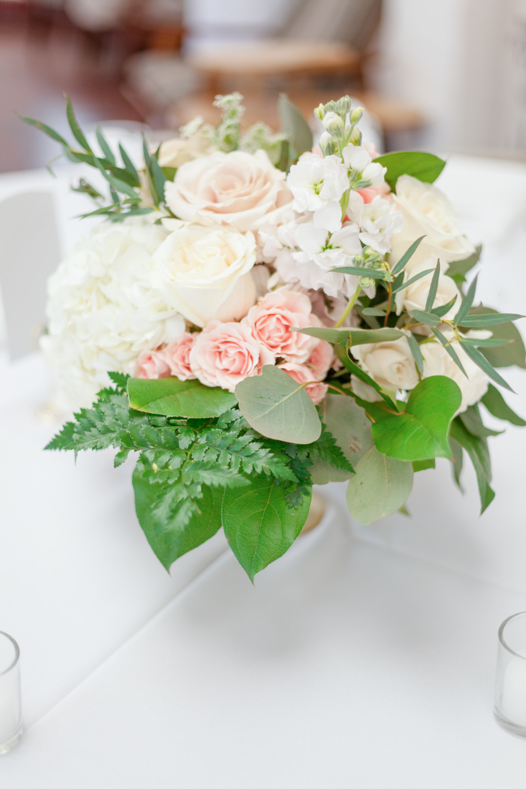 Indoor Wedding Reception with Round White Tables and Small Peach and White Floral with Greenery Centerpiece | Tampa Bay Wedding Florist Cotton and Magnolia