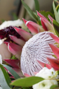 Pink Protea Wedding Bouquet Detail with White and Burgundy Floral and Greenery
