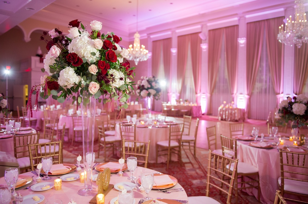Country Club Ballroom Wedding Reception, with Red, Pink and White and Greenery Tall Centerpiece, Oversized Gold Glitter Table Numbers, and Gold Chiavari Chairs | Tampa Bay Wedding Venue Palma Ceia Golf and Country Club