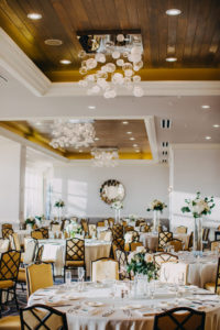 Modern Indoor Hotel Ballroom Wedding Reception with High and Low Ivory Floral with Greenery Centerpieces in Glass Vases | Tampa Bay Waterfront Hotel Wedding Venue Hyatt Regency Clearwater Beach