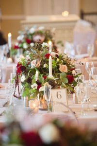 Modern Winter Pink and Burgundy Hotel Ballroom Wedding Reception with Low Red, Blush and Burgundy Floral with Greenery Centerpiece, Blush Linen from Rental Company Over the Top, and Candles | St Petersburg Wedding Planner Parties A La Carte |