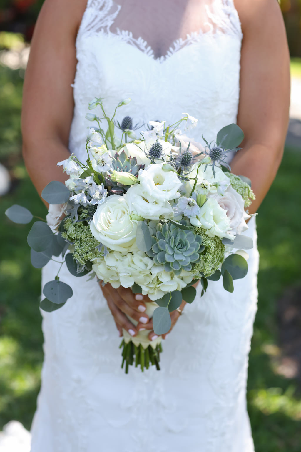 Outdoor Bridal Portrait wearing Lace Neckline Column Wedding Dress with White and Greenery Bouquet with Thistle and Succulents | Tampa Bay Wedding Photographer Lifelong Photography Studios