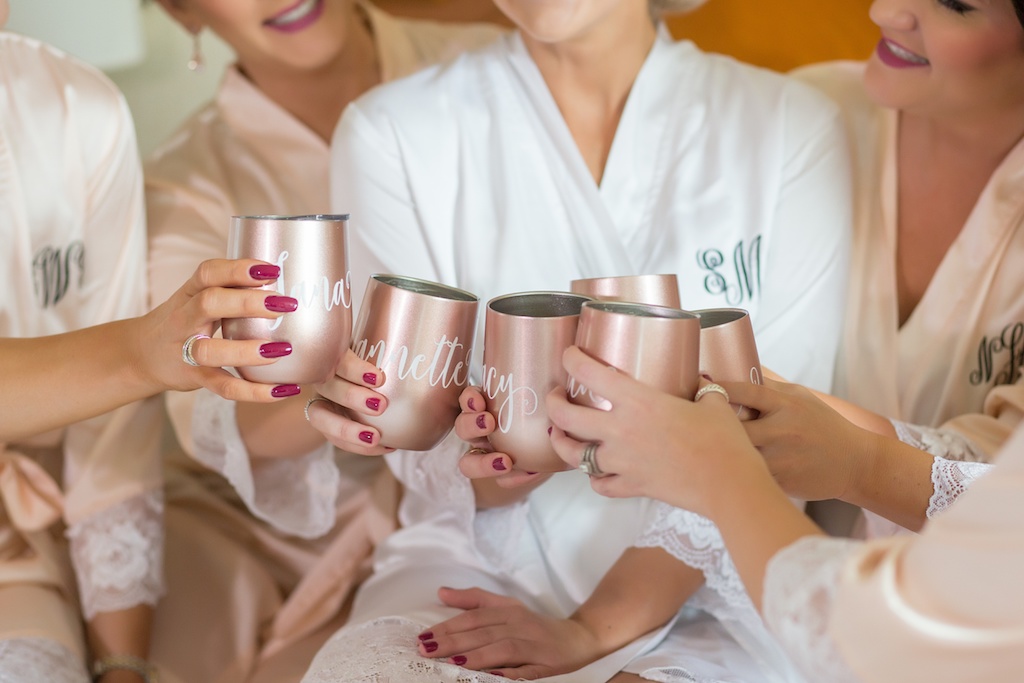 Bridal Party Portrait in Blush and White Silk Monogramed Robes with Personalized Copper Wine Glasses and Matching Magenta Manicures | Tampa Wedding Photographer Andi Diamond Photography