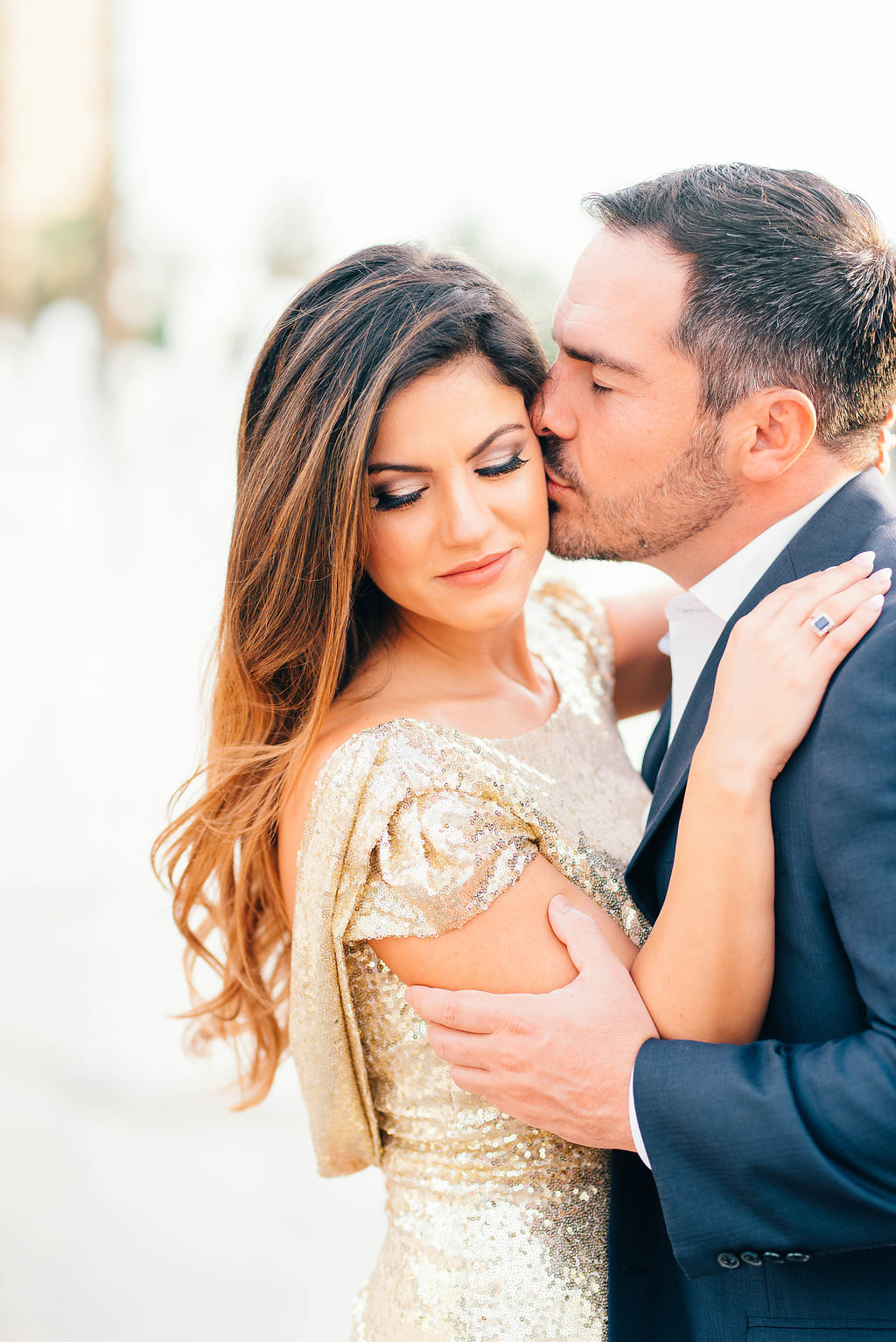 Downtown Tampa Riverwalk Classy Engagement Portrait, Bride in Long Gold Sequin Dress, Groom in Navy Blue Suit with Brown Leather Shoes