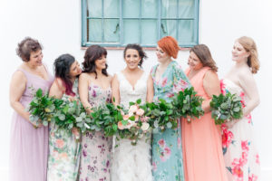Outdoor Bridal Party Portrait, Bride in V Neck David's Bridal Dress and Peach Floral Bouquet, Bridesmaids in Mismatched Pastel Solid and Floral Print Purple, Pink, and Green Dresses with Greenery Bouquets | St Petersburg Wedding Florist Cotton and Magnolia