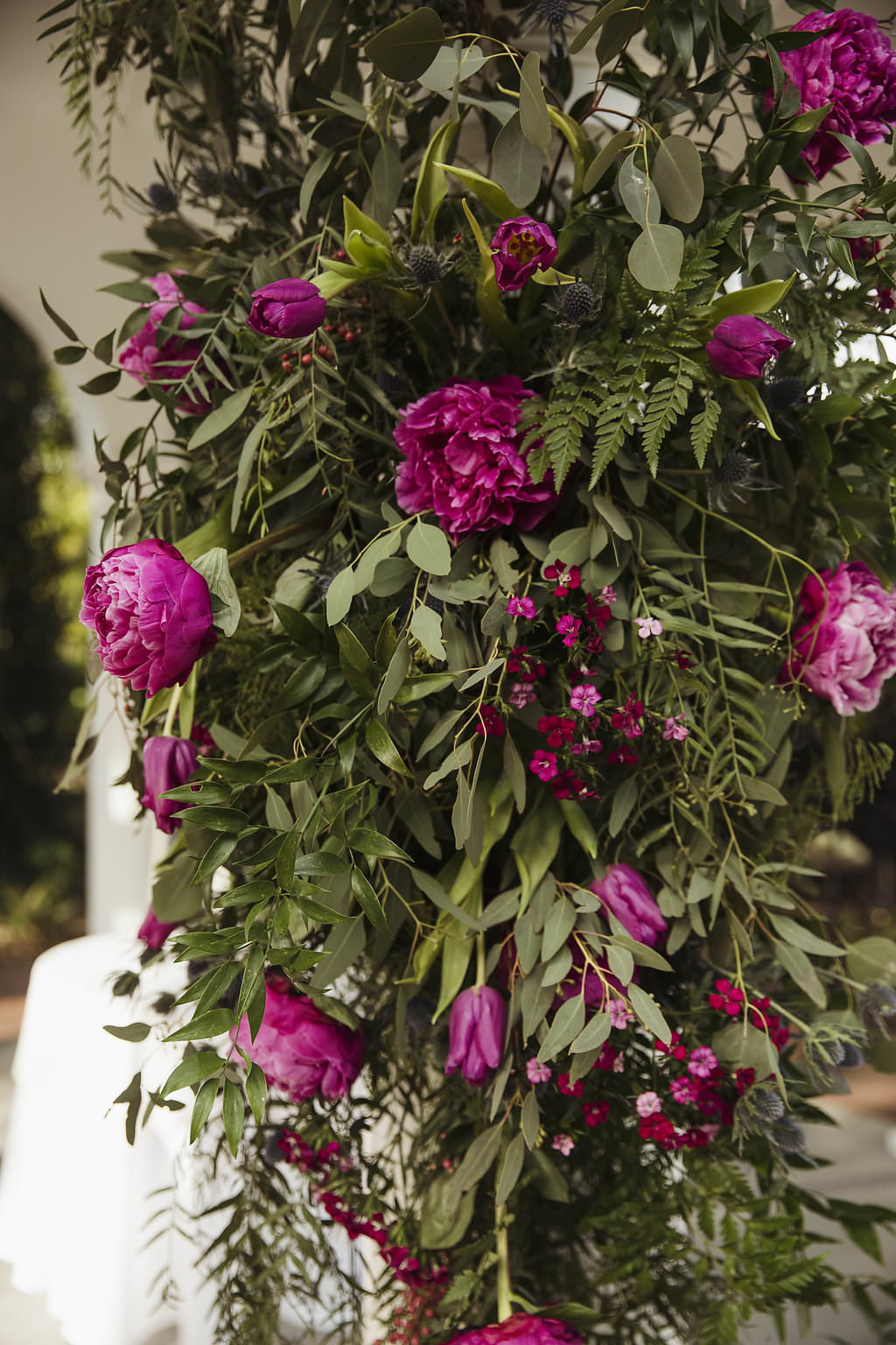 Fuchsia and Pink Floral with tropical Greenery Outdoor Ceremony Arch Decor
