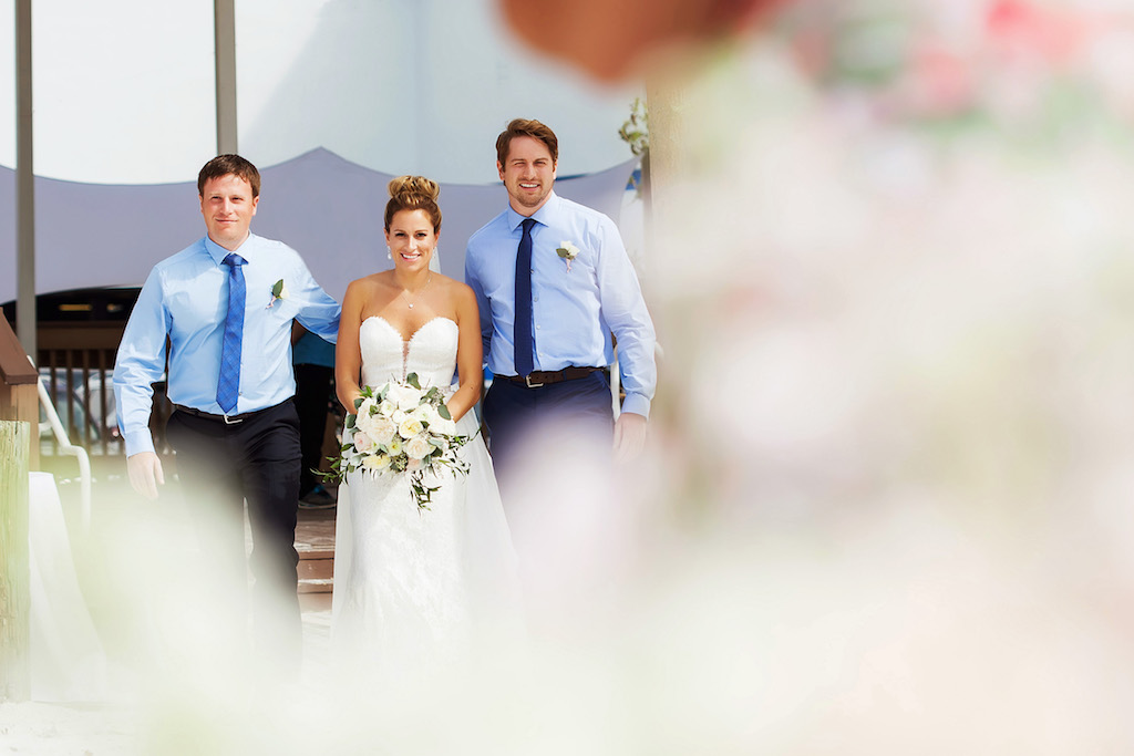 Outdoor Wedding Ceremony Bridal Portrait in Strapless Dress with White Rose and Greenery, Brothers in Blue Shirts with Ties and Rose Boutonniere